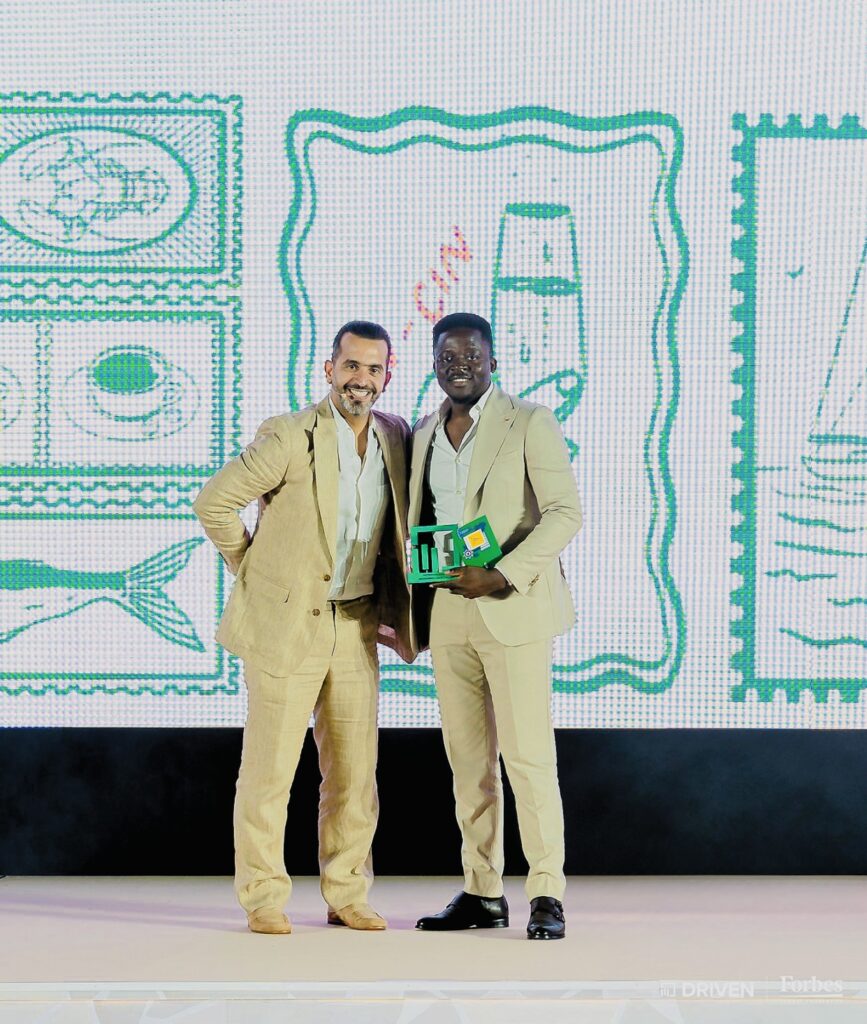 Mohammed Umar Zakaria receiving an award at the Driven | Forbes Global Properties annual gala